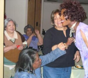 A joyful group of women enjoying a social gathering indoors.